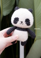 Забавная игрушка панда